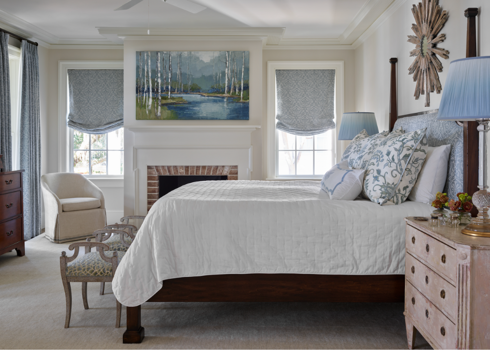 traditional isle of hope savannah georgia area home bedroom with a fireplace decorated in blue and white