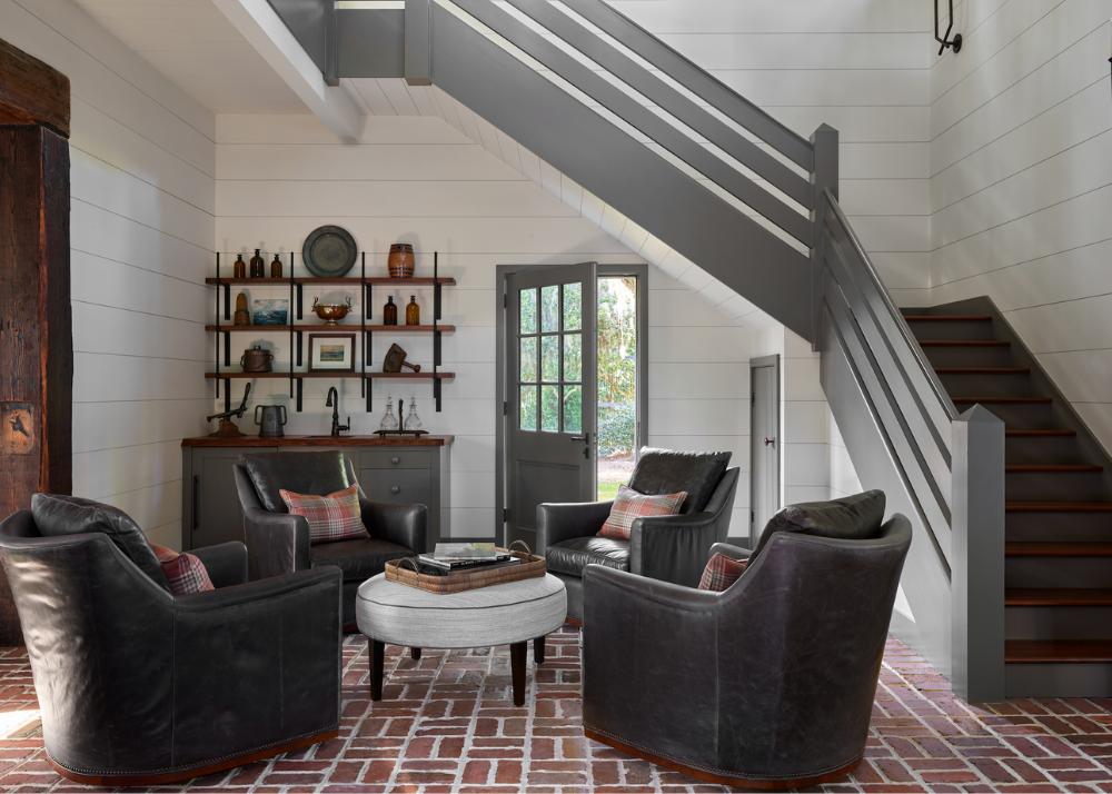traditional isle of hope savannah georgia area home with brick floors and exposed beams and a four club chairs