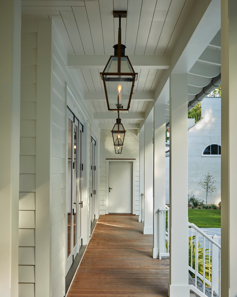 expansive covered porch with gas lanterns
