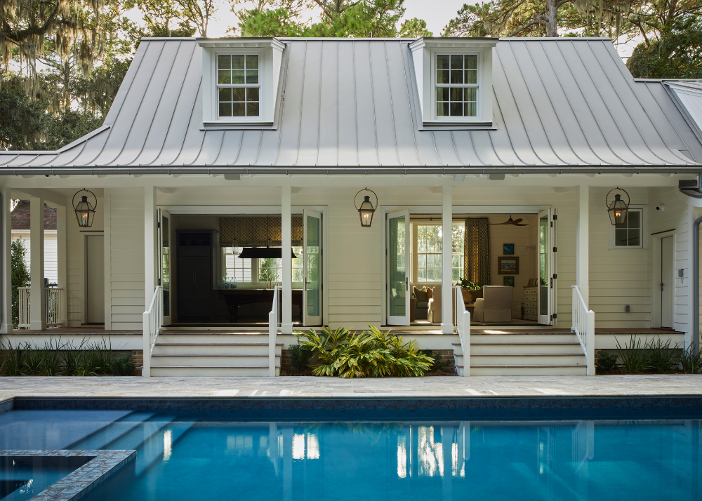 white pool house with open doors