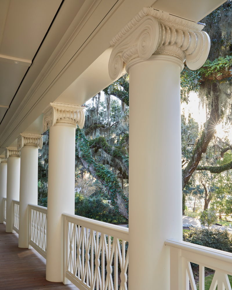 covered porch with traditional greek columns