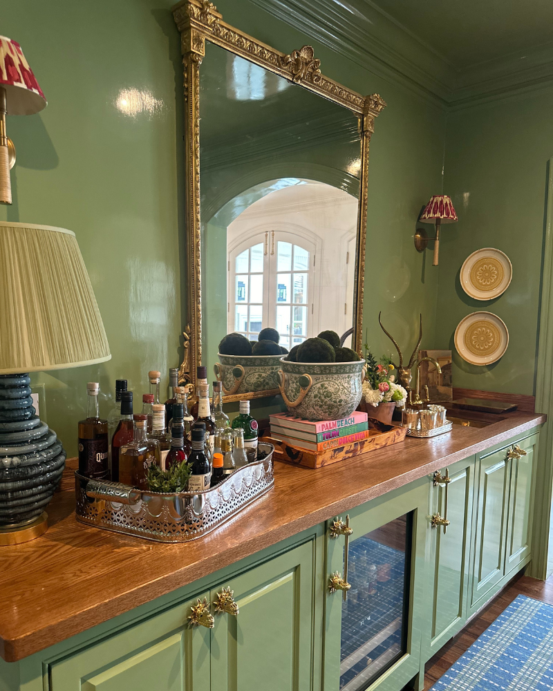 Green lacquered room with a built-in bar and wine/drink fridge