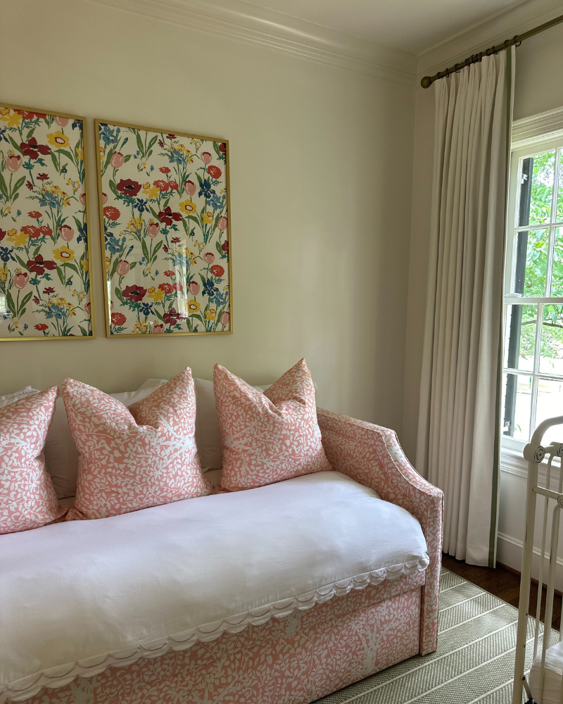 classic nursery for girls with pink floral trundle bed