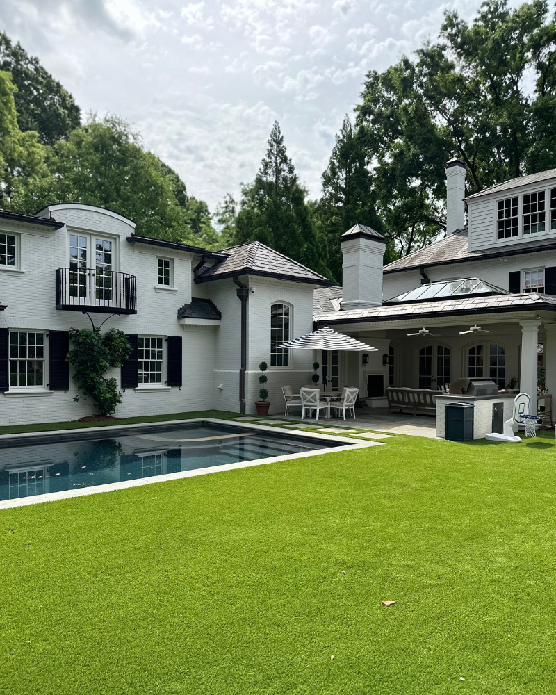 outdoor living space, pool, and turf yard