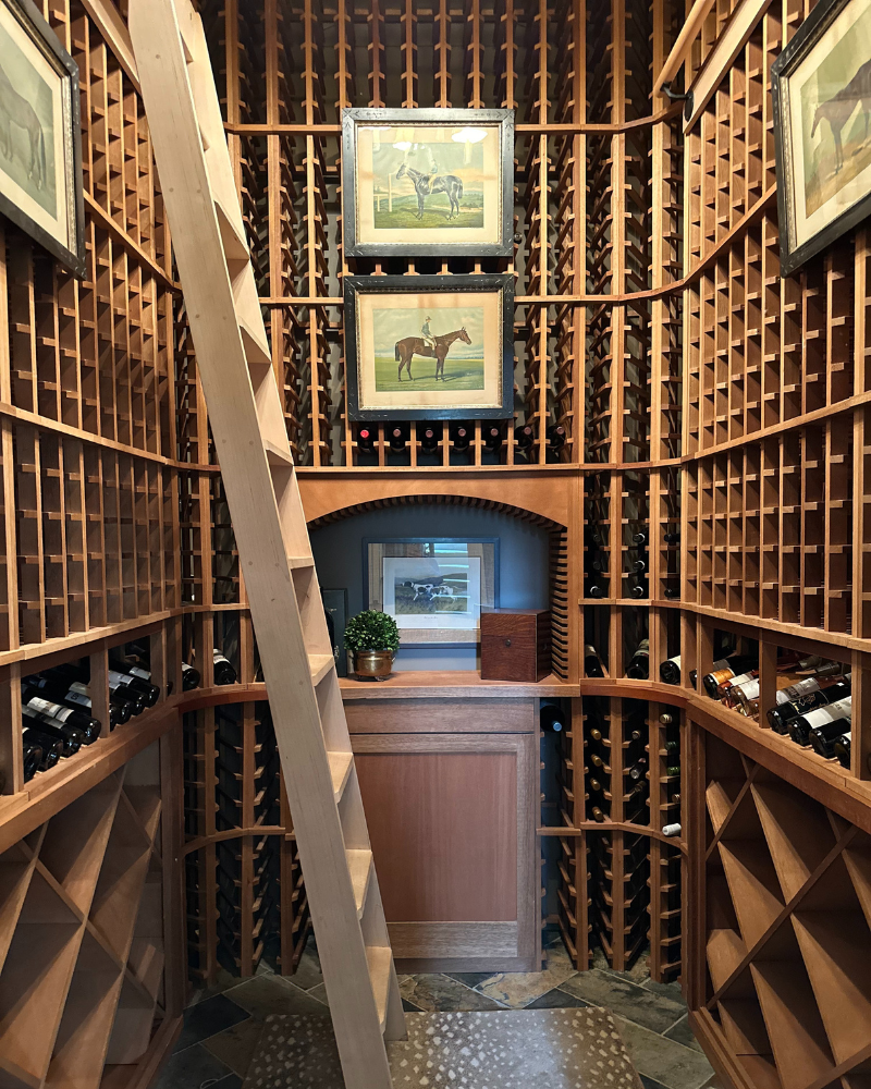 timeless wine cellar with wood walls and horse art