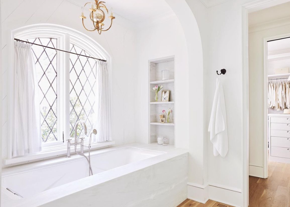 Visual Comfort Gramercy Mini in a spa-like primary bathroom