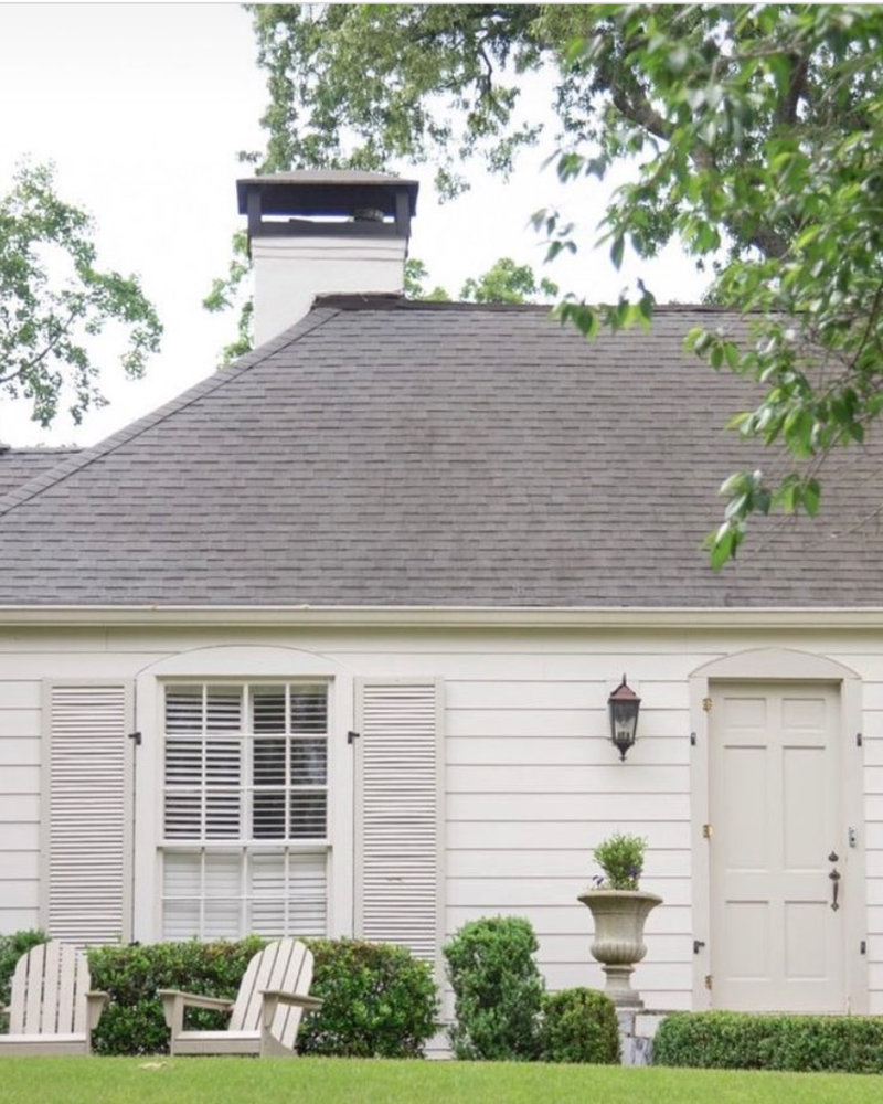 If you want something a little creamier than White Dove, Benjamin Moore’s Swiss Coffee is a popular option—for good reason. We love how the home captured by Cover Me in Ivy paired it here with Revere Pewter on the shutters and front door for a traditional, tonal look.